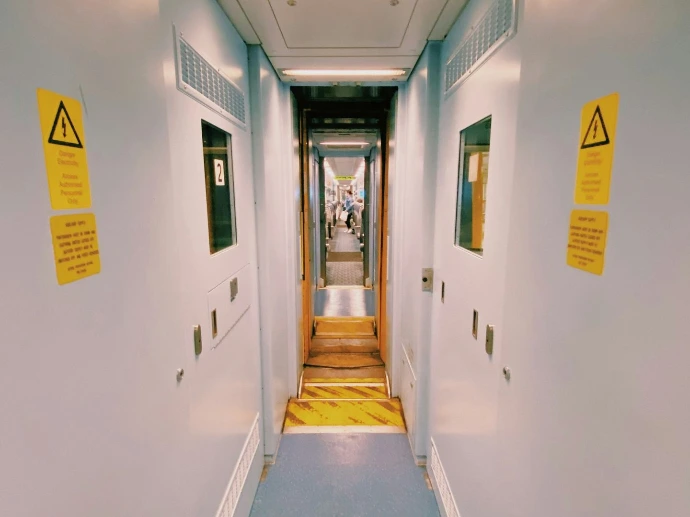 white concrete building with yellow door